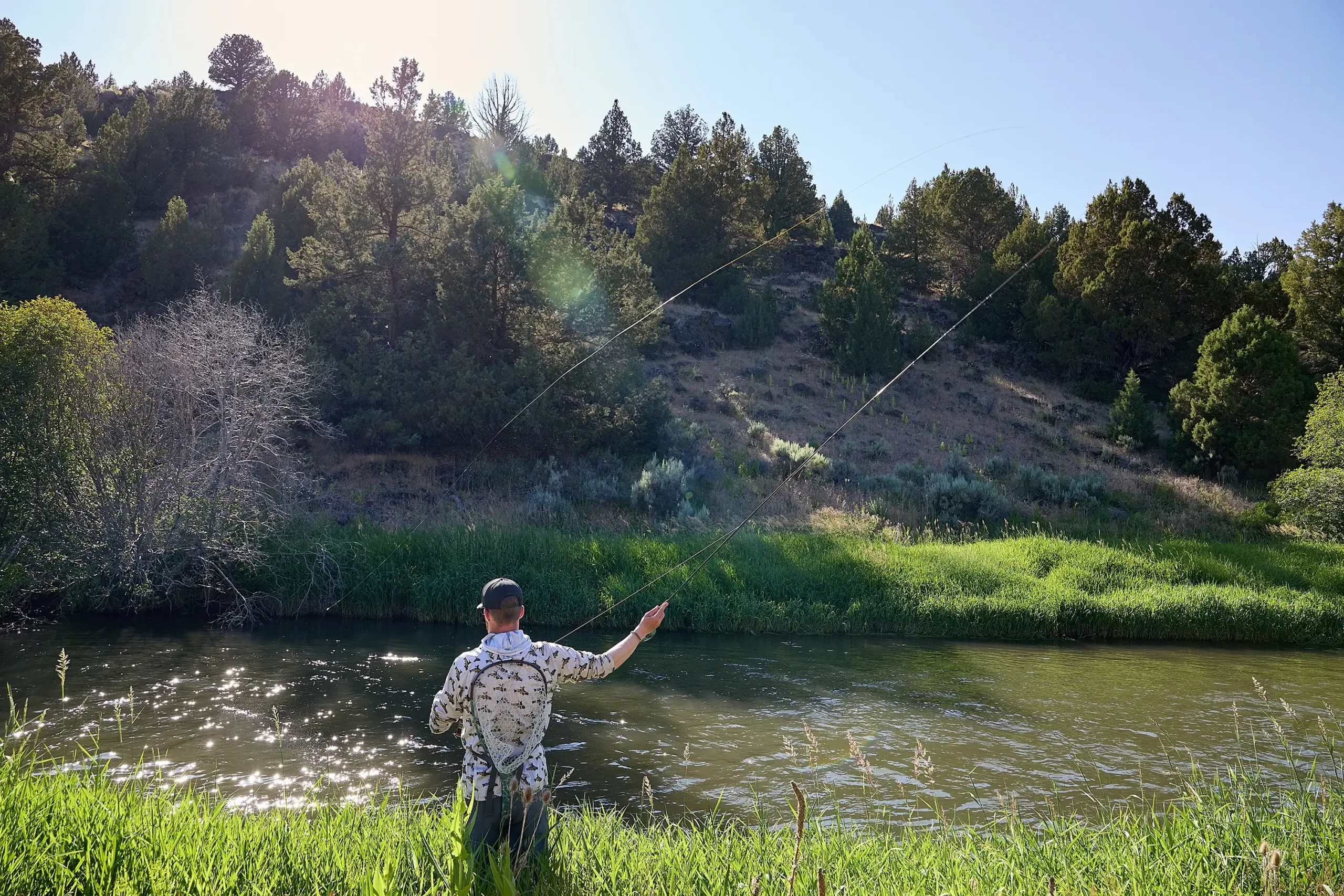 A man casting a fishing line in Harney County.