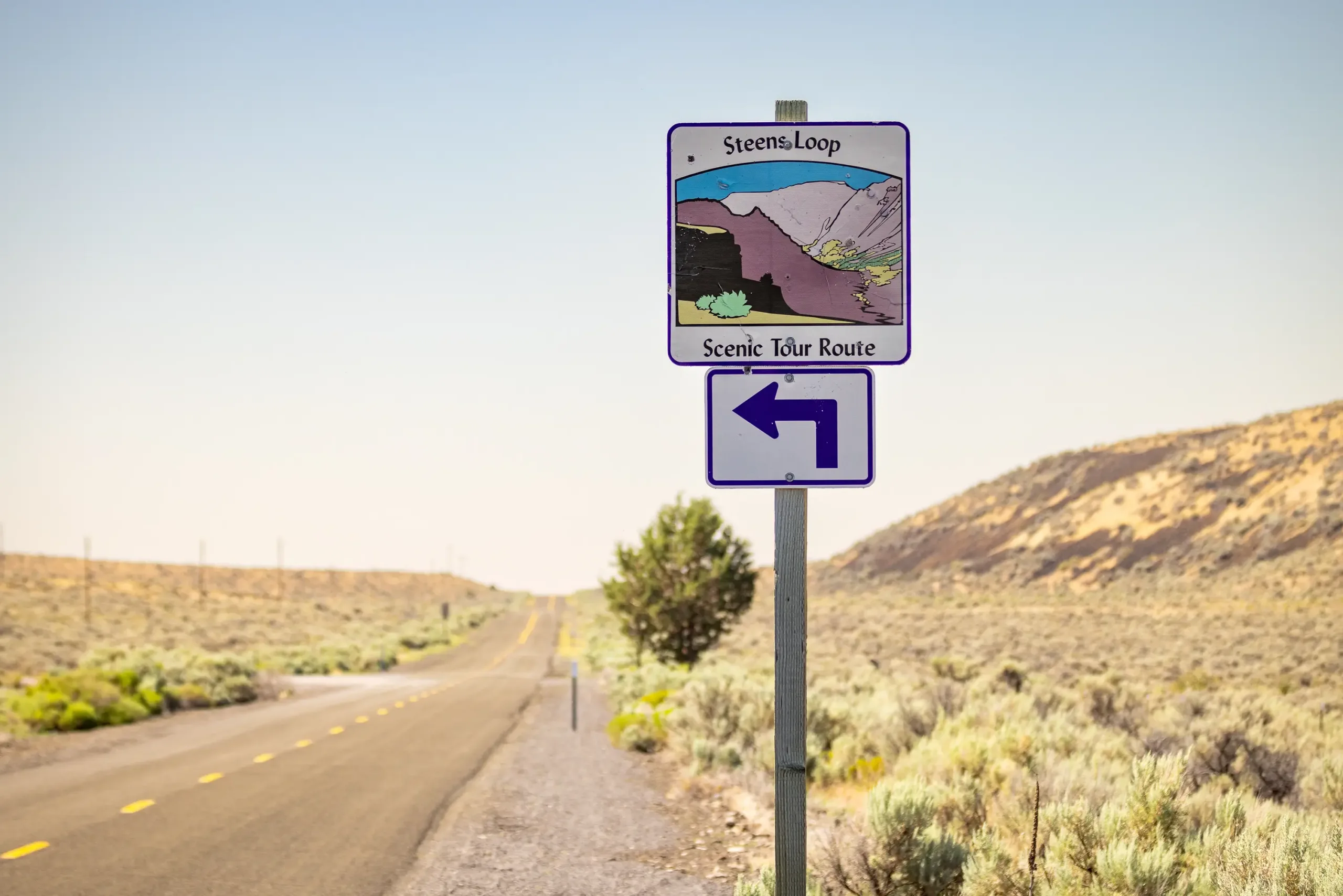 A sign pointing out the direction of the Steens Loop